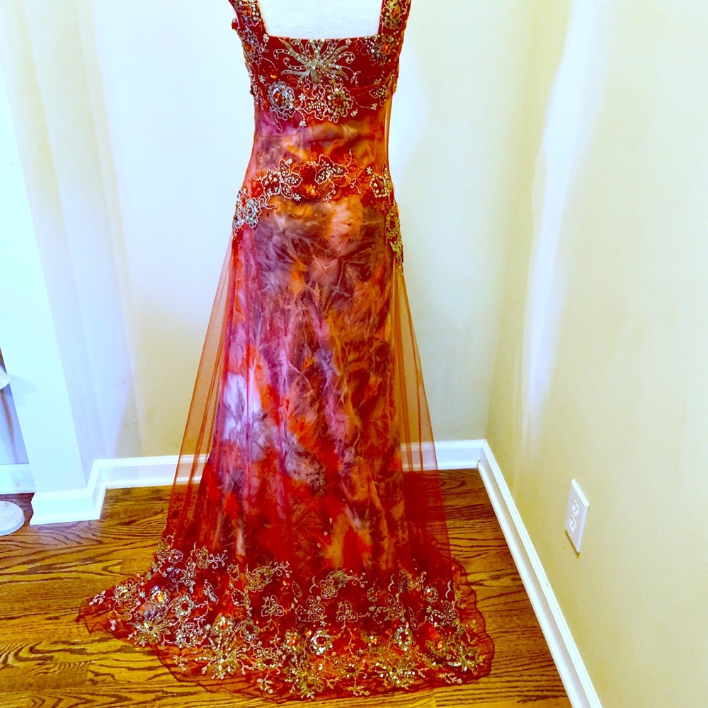 Jouani long formal or prom gown in reds and pinks